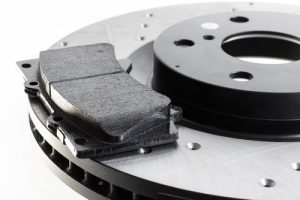 Two,Brake,Discs,And,Pads,On,A,White,Background - Auto Repair in York, PA Brake pads | Meineke Harrisburg, PA