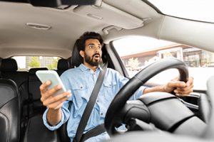 Distracted,Driving,Concept.,Shocked,Scared,Handsome,Young,Indian,Man,In - Auto Repair in York, PA Texting and Driving